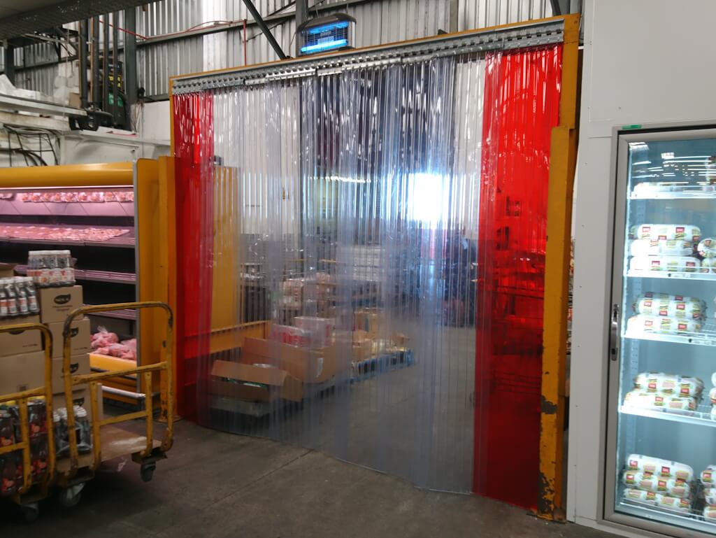 Standard PVC strip curtains combined with transparent coloured PVC strip curtains